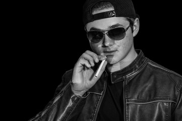 young man is about to smoke his first cigarette and begin a new habit