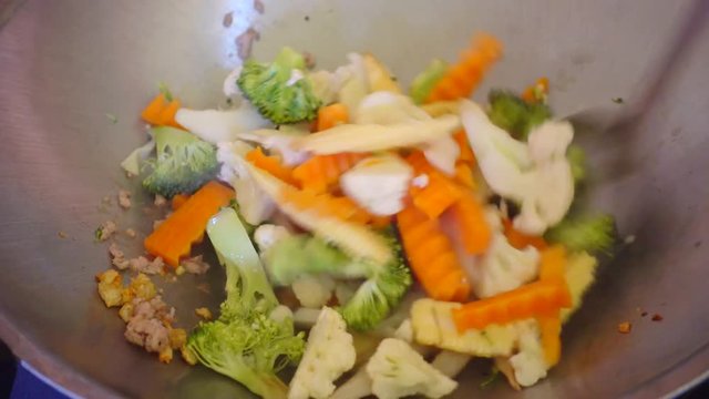 Delicious pan stir fried colorful fresh vegetables meal - closeup