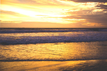 Naklejka na ściany i meble Sunset on the beach