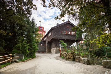 Fototapeta na wymiar Old wooden house and Bredablick tower