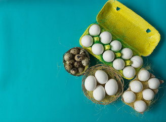 White chicken Chicken and quail eggs in colored paper eco-friendly packaging with  sisal Close-up photo Easter background 