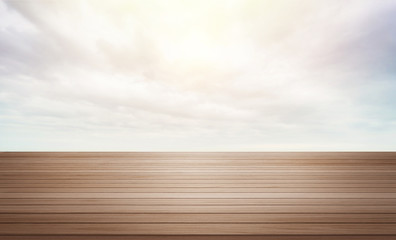 Design concept - Empty dark wood table top with dramatic cloudy sky background for display or montage product