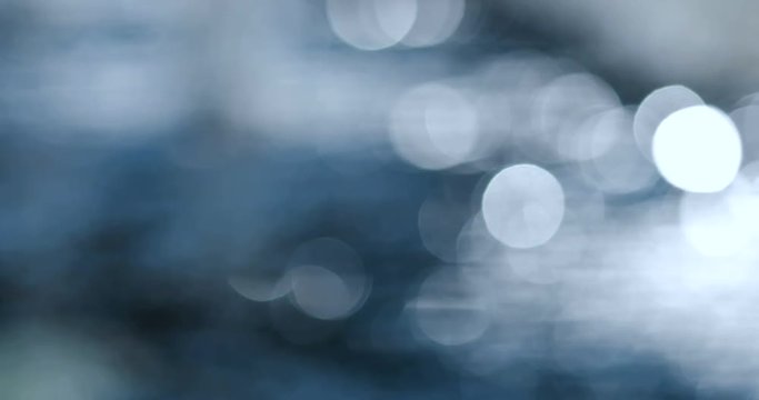 Abstract bokeh water flowing dark blue tone , 4k dci resolution