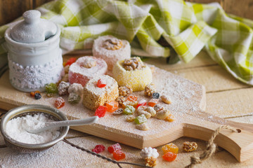 East sweets with fruits, nuts and sugar powder