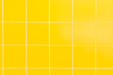 Yellow ceramic tiles background in bathroom