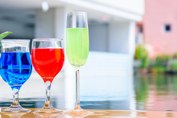 Colorful tropical cocktails at swimming pool with summer vacation holiday concept.