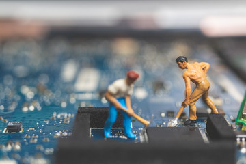 Miniature people : Worker team of engineers repairing keyboard computer laptop