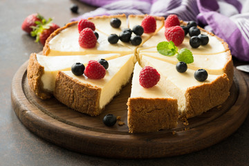 Summer berry cheesecake cut into slices. Selective focus