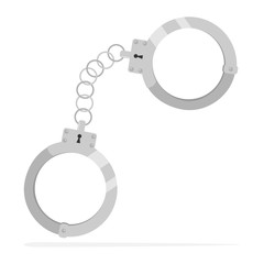 realistic handcuffs of a policeman with a shadow.