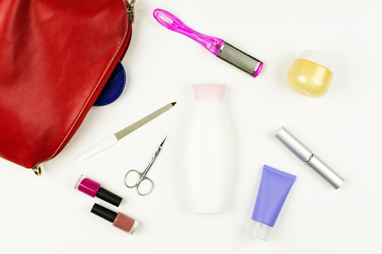 Manicure bag and tools, leg's nail careconcept on white background. Flat lay