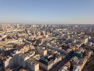 Fototapeta premium City landscape of Kiev with modern and old houses roads with cars, Ukraine. Drone photography