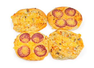 Four small pizza with different stuffing on a white background