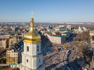 Naklejka premium view landscape in Kiev with St. Sophia bell tower and people sightseeing at Sofiiska square