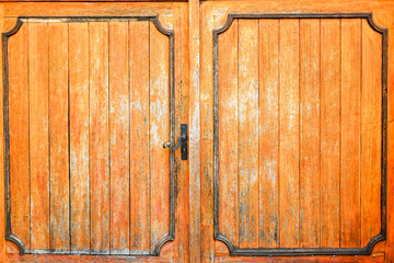 Old gothic wooden doors with lock.
