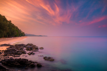 Fototapeta na wymiar Amazing beautiful beach of Koh Lanta Island in Krabi, Thailand during stunning sunrise, a postcard from an Andaman sea of Thailand.