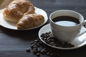 A cup of coffee and breakfast meal