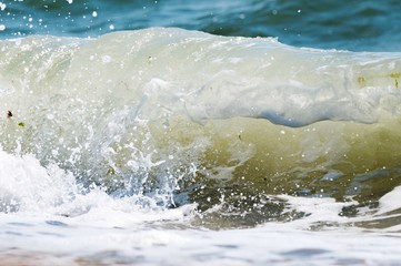 Big wave on the sea  with a lot of foam. fake color. Copy space. Concept of travel.