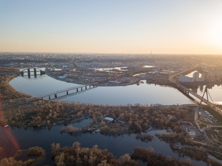 Naklejka premium Panoramic view of the city of Kiev and bridges and the Dnieper river at sunset