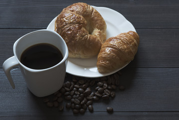 A cup of coffee and breakfast meal