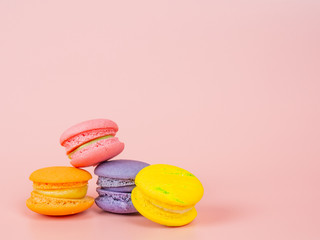colorful macaron or macaroon on pink background