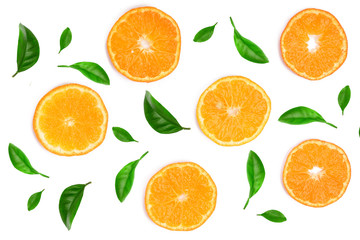 Slices of orange or tangerine decorated with green leaves isolated on white background, top view. Fruit composition