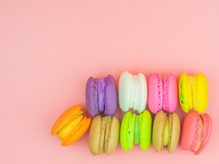 colorful macaron or macaroon on pink background