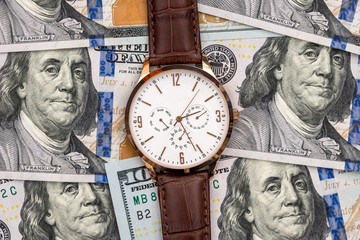 Dollar with hand watch, time is money