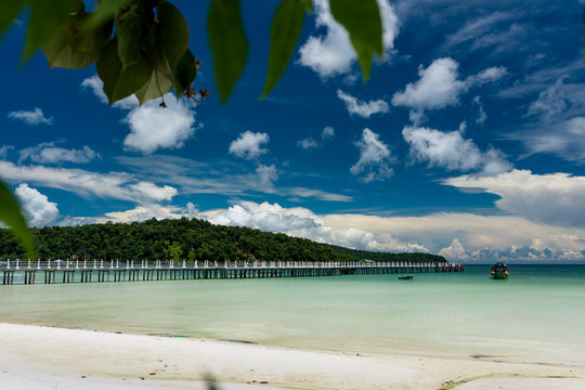 Tropical landscape of Koh Rong Samloem island with turquoise water and pier in the distance. Cambodia, asia.