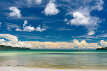 Tropical beach with turquoise clean water,  blue sky and white sand. Saracen Bay, Koh Rong Samloem. Cambodia, Asia.
