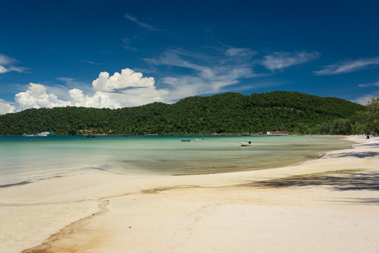 Tropical beach with turquoise clean water,  blue sky and white sand. Saracen Bay, Koh Rong Samloem. Cambodia, Asia.
