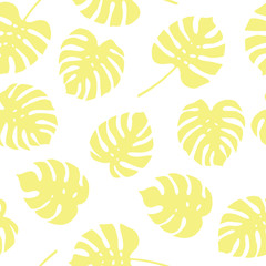 Seamless pattern of yellow monstera leaves. Tropical leaves of palm tree background