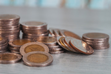 Stacking money coins on wood background, the saving with growing up your money.
