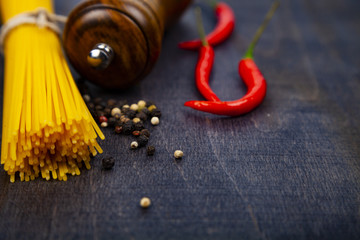 Spaghetti on a dark wooden background
