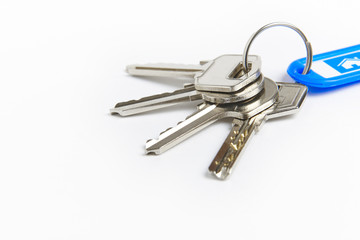 Key ring with keys over white background. Rent