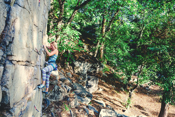 girl climber on a rock.