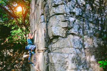 girl climber on a rock.