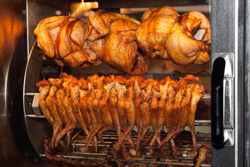 Grilled chicken in oven close up view