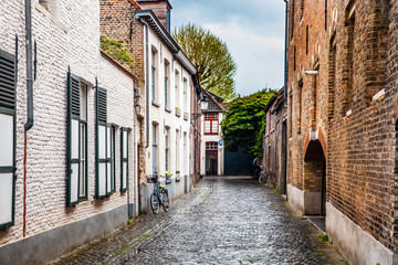 Quiet courtyard, typical architecture of Bruges city, Belgium