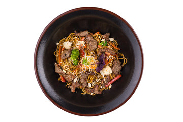 Egg noodles with beef and vegetables under teriyaki sauce, isolated on white background.