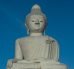 Big buddah close-up, phuket over clear blue sky