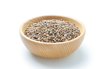 Natural organic lentils in a wooden bowl.