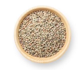Natural organic lentils in a wooden bowl. Top view.