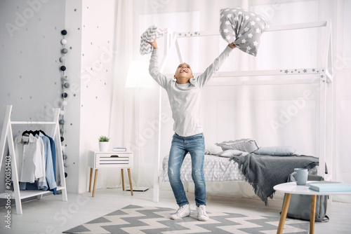 Excellent News Merry Afro American Boy Jumping While Throwing Up