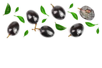 Dark grapes decorated with green leaves isolated on white background with copy space for your text, top view. Flat lay