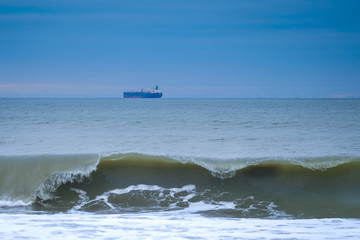 Ship at sunset in the distance in the sea 1