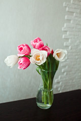 a bouquet of tulips in a vase