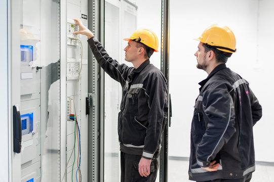 Field service crew testing electronics or inspecting electrical installation system