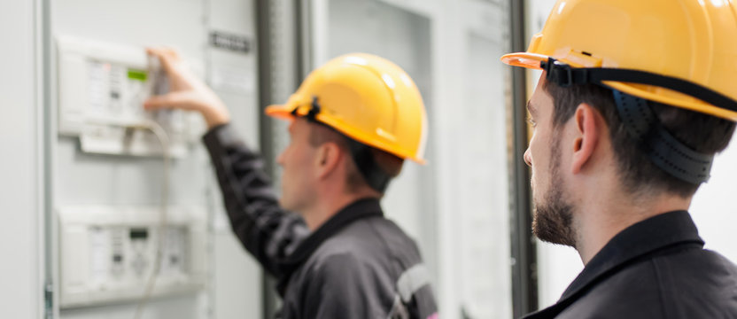 Field service crew testing electronics or inspecting electrical installation system