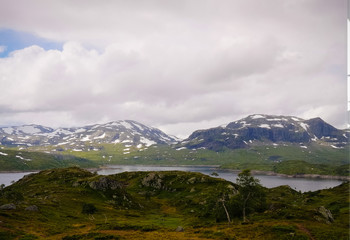 Fototapeta na wymiar Panoramic view to Hardangervidda plateau and Votna lake at Norway