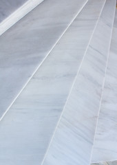Close-up view of geometrical background of light stone marble stairs